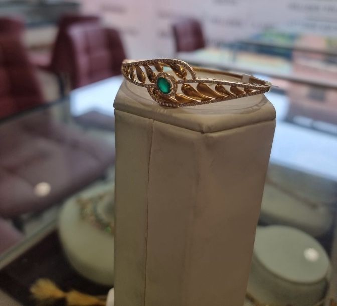 The phone photo it came from: the same bangle on a display stand